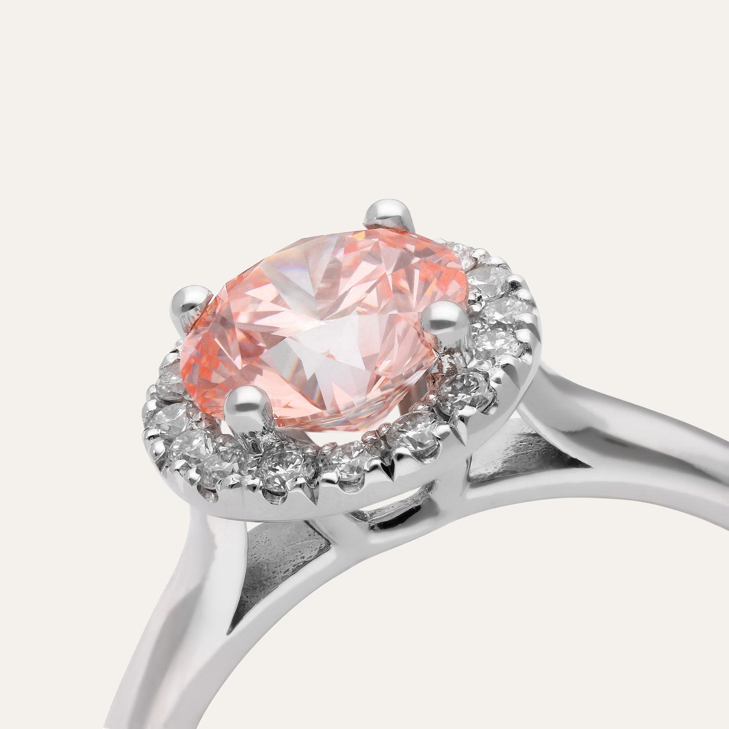 Classic round engagement ring with halo in fancy pink (1.50 ct)