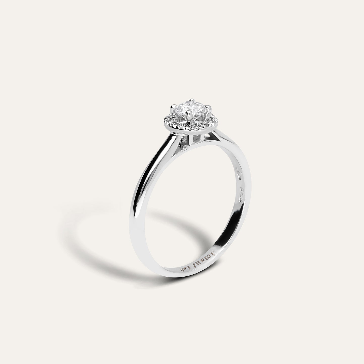 Classic round engagement ring with halo (0.31 ct)