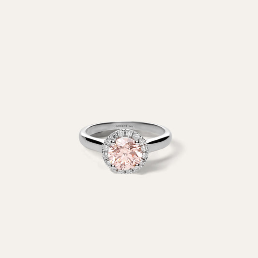 Classic round engagement ring with halo in fancy pink (1.50 ct)